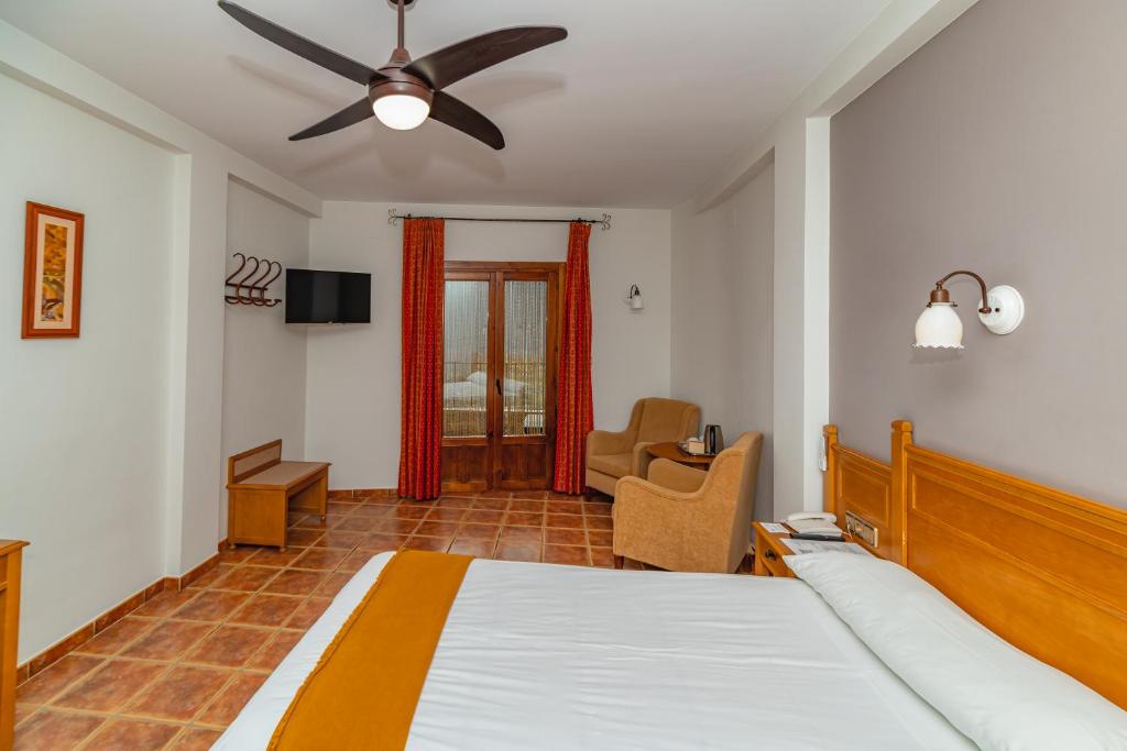 Postel nebo postele na pokoji v ubytování Hotel La Fragua II