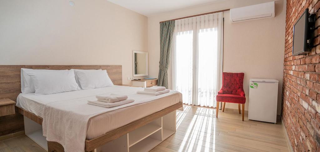 Postel nebo postele na pokoji v ubytování Harakop Otel