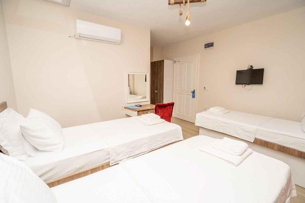 Postel nebo postele na pokoji v ubytování Harakop Otel
