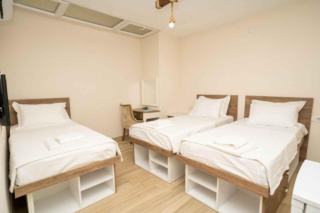 Postel nebo postele na pokoji v ubytování Harakop Otel