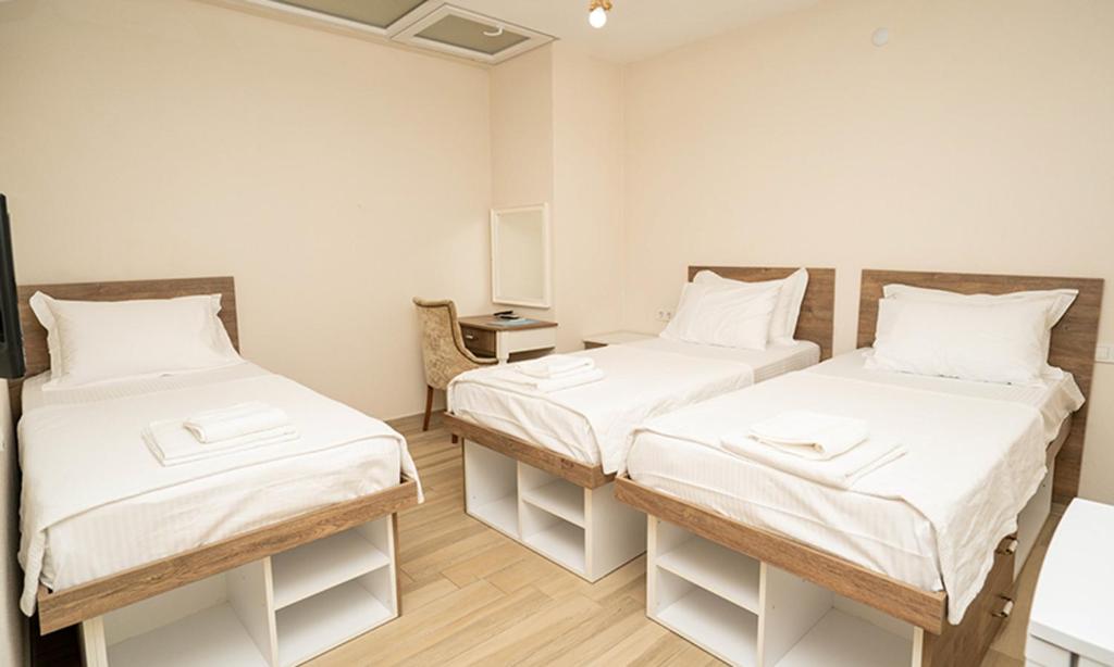 Postel nebo postele na pokoji v ubytování Harakop Otel