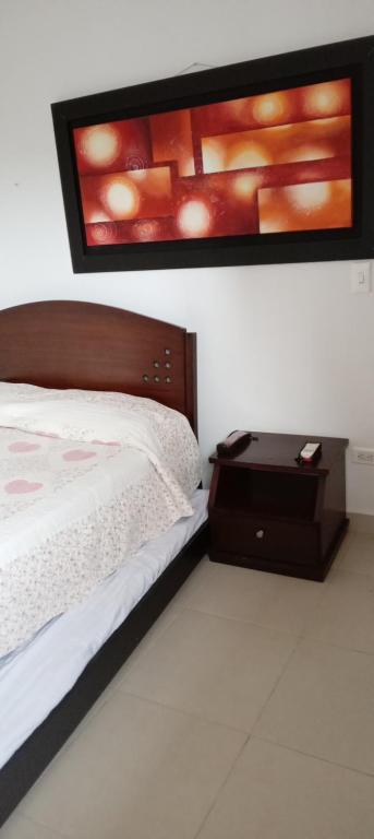 Llit o llits en una habitació de Bellohorizonte Apartamento SMR