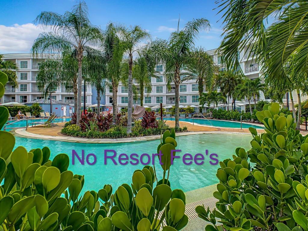 a no resort fee sign in front of a swimming pool at Pet Friendly in Orlando area near Disney in Orlando