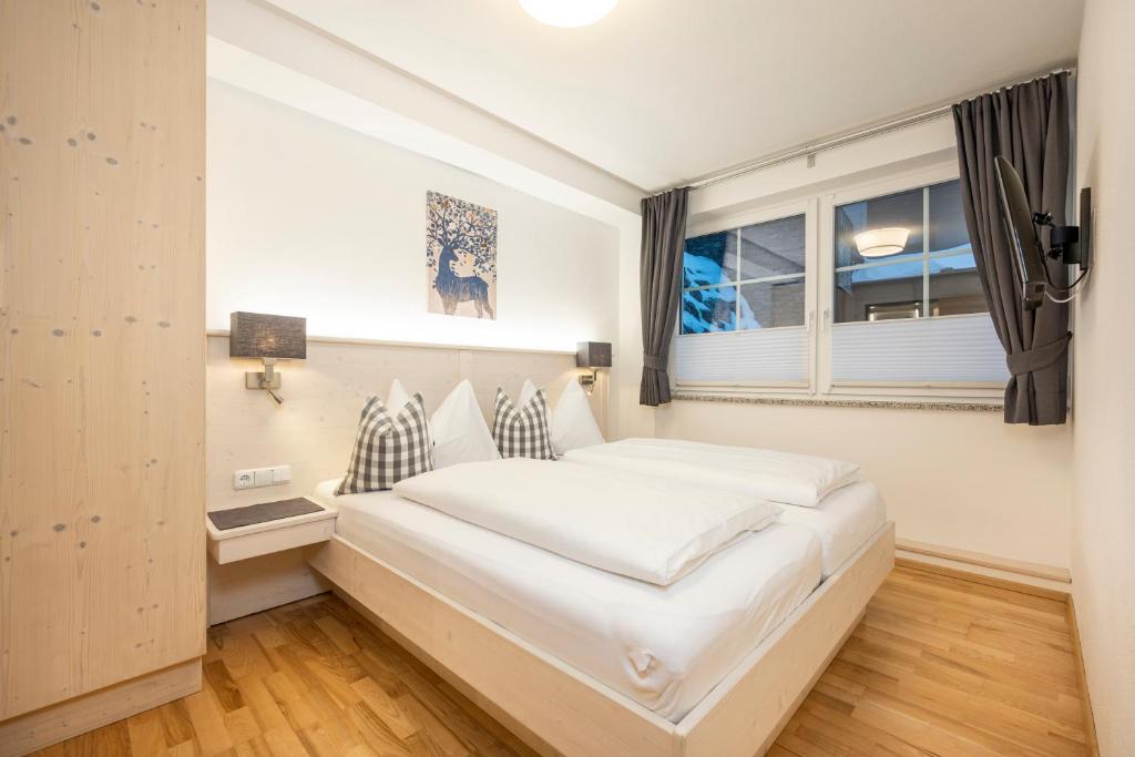 Postel nebo postele na pokoji v ubytování Appartement Haus Faßwald