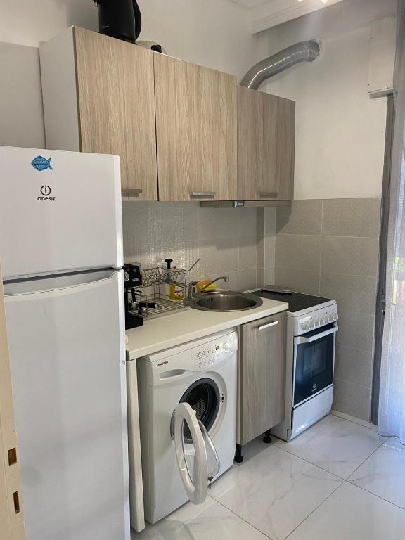 Kuchyň nebo kuchyňský kout v ubytování Vasilev Apartment, Nea Kallikratia