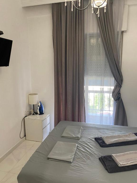 Postel nebo postele na pokoji v ubytování Vasilev Apartment, Nea Kallikratia