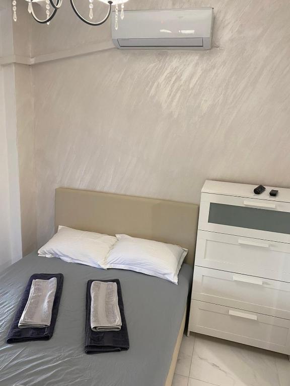 Postel nebo postele na pokoji v ubytování Vasilev Apartment, Nea Kallikratia