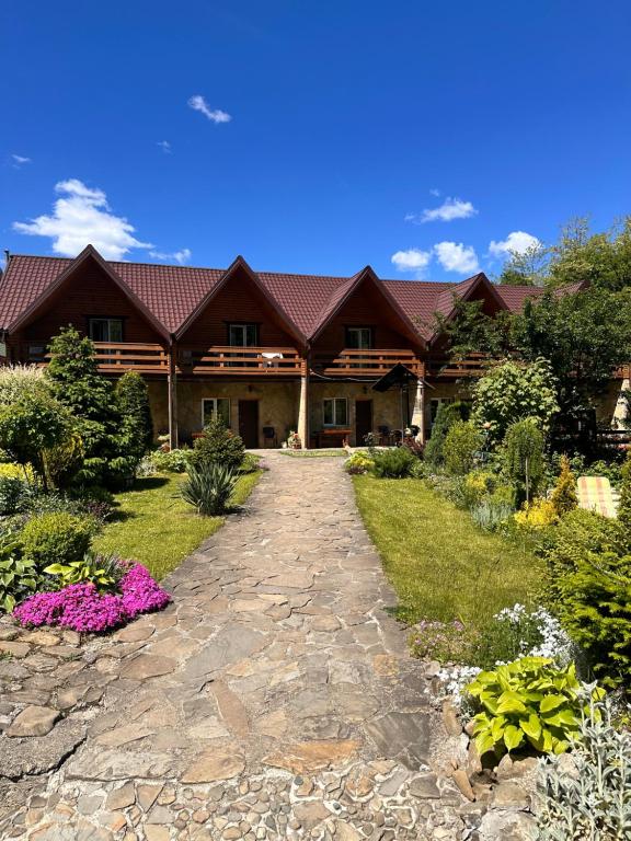 a house with a pathway in front of it at Kipreya in Yaremche