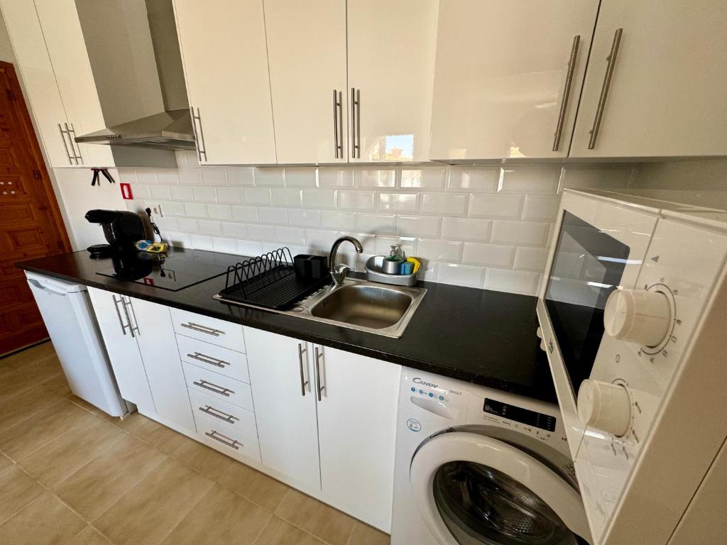 Kuchyň nebo kuchyňský kout v ubytování Apartamento Agua Rosa