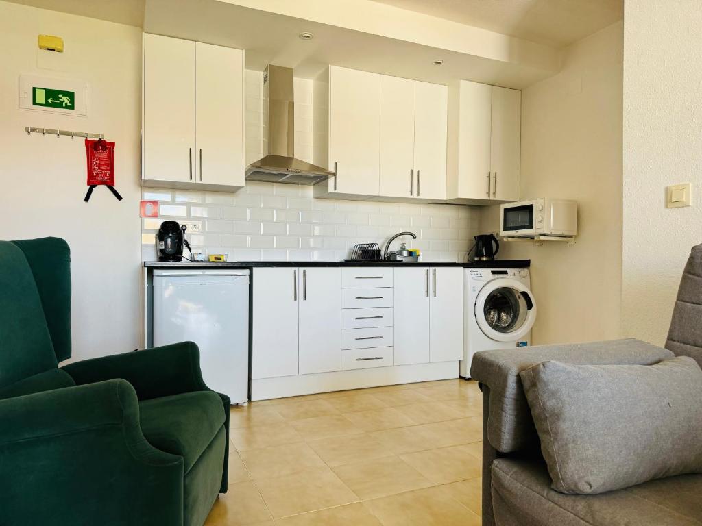 Kuchyň nebo kuchyňský kout v ubytování Apartamento Agua Rosa