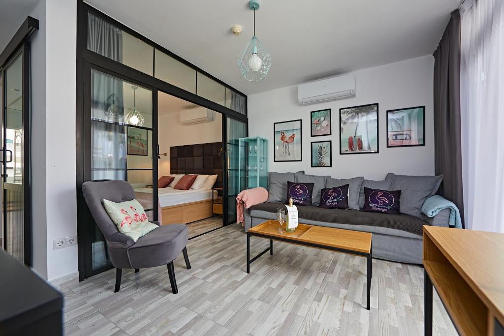 a living room with a couch and a table at APARTMENT FLAMINGO in Playa del Ingles