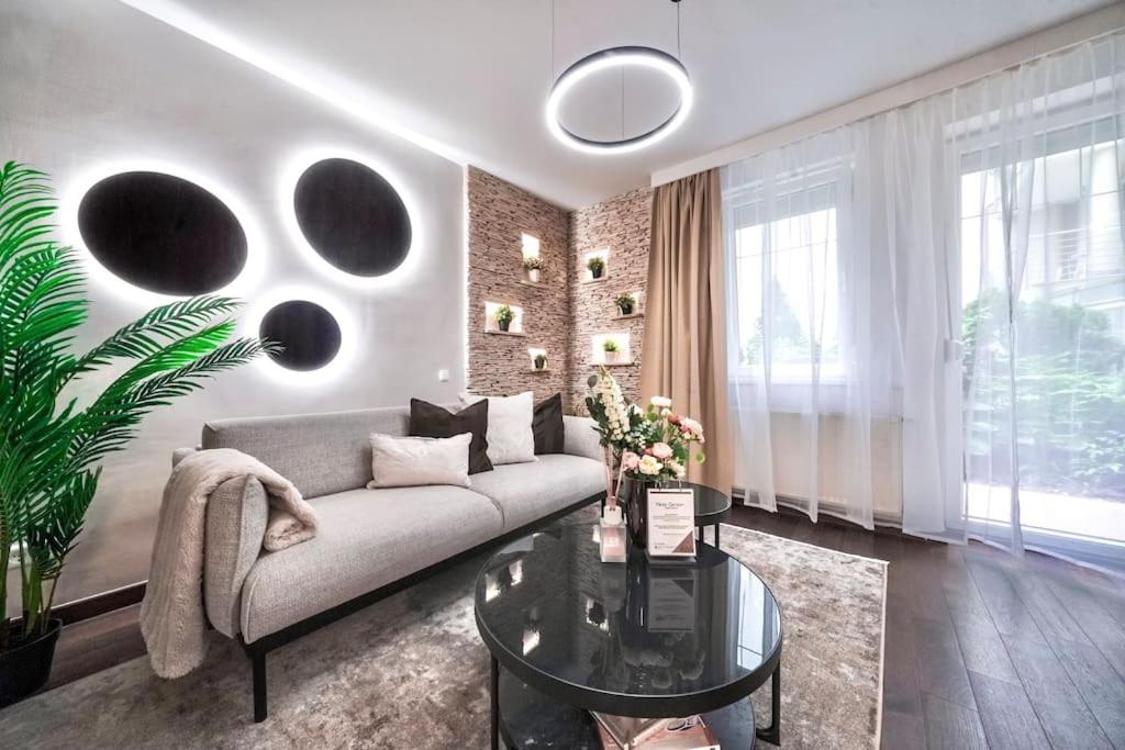 a living room with a couch and a table at One bed apartment at central location in Budapest in Budapest