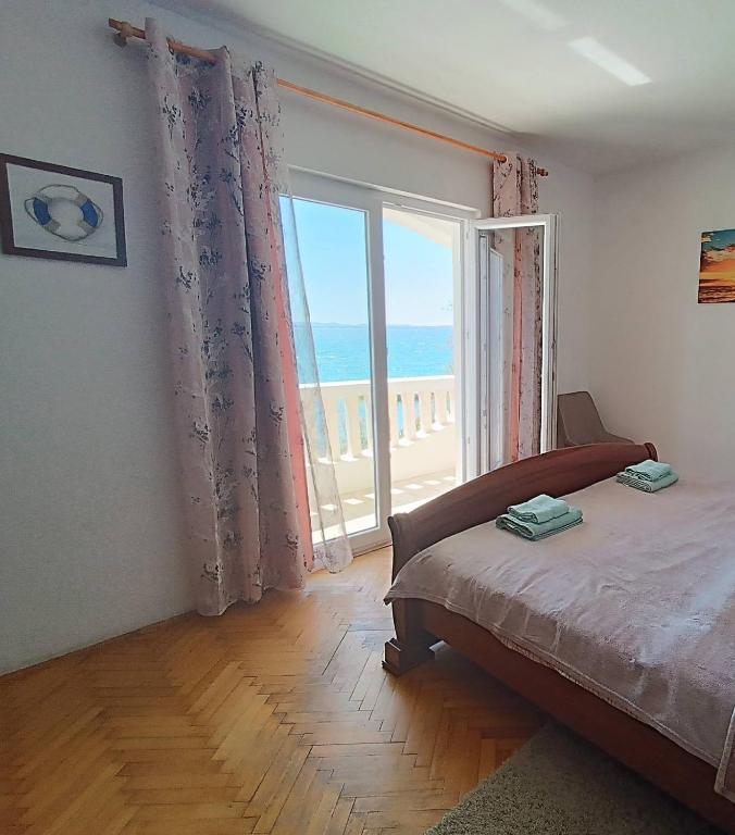 Posteľ alebo postele v izbe v ubytovaní Apartmani Živković