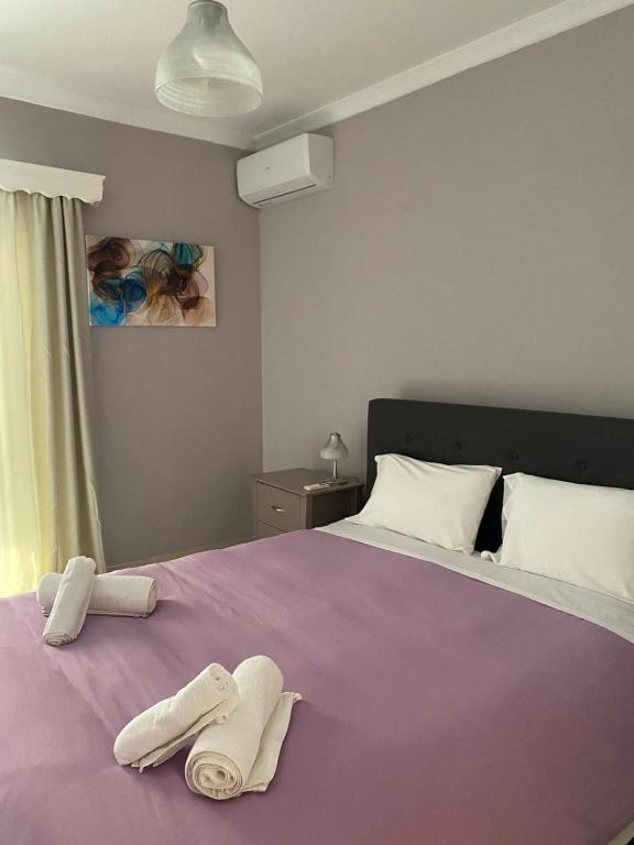 Łóżko lub łóżka w pokoju w obiekcie SOFICOS Sea View Apartment