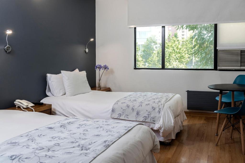Postel nebo postele na pokoji v ubytování Hotel Nippon y Centro de Eventos