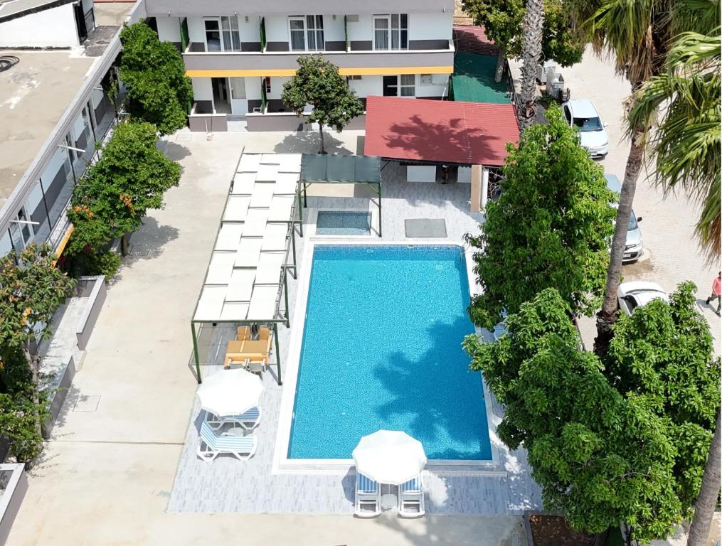 an overhead view of a swimming pool in a hotel at Hillside Apart House in Side