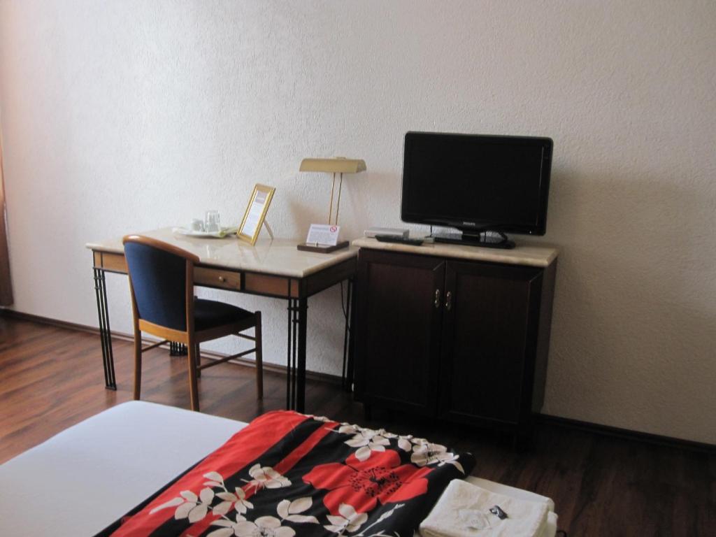TV a/nebo společenská místnost v ubytování Hotel-12-Apostel