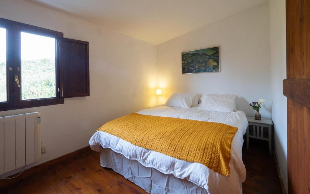 Postel nebo postele na pokoji v ubytování La Entretenida