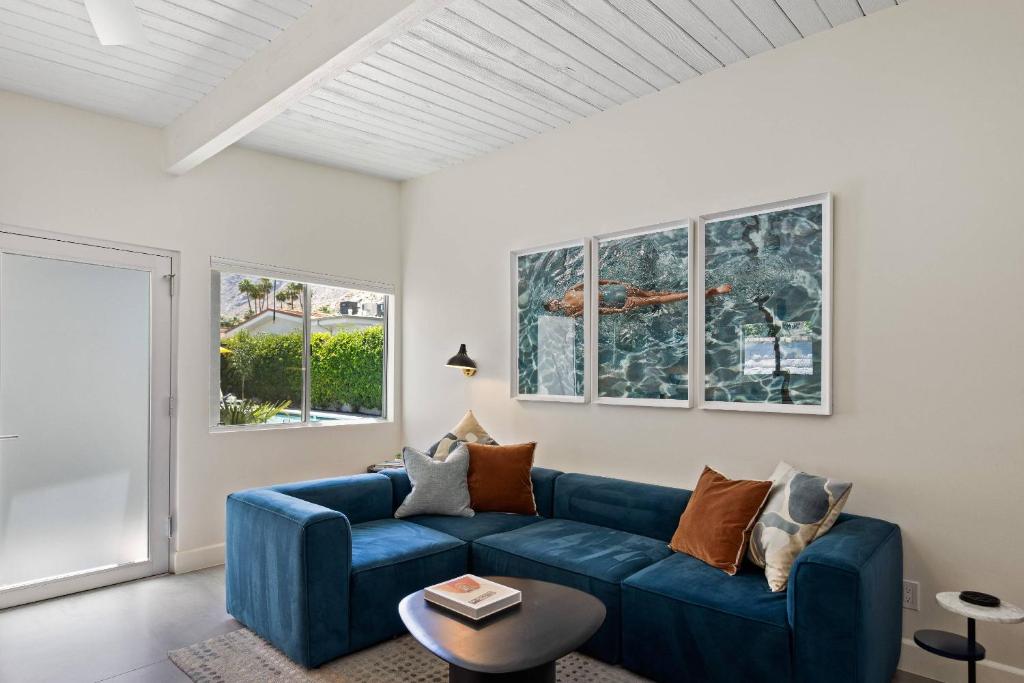 a living room with a blue couch and a table at *Condo - 606 W Arenas Rd Unit 3, Palm Springs in Palm Springs