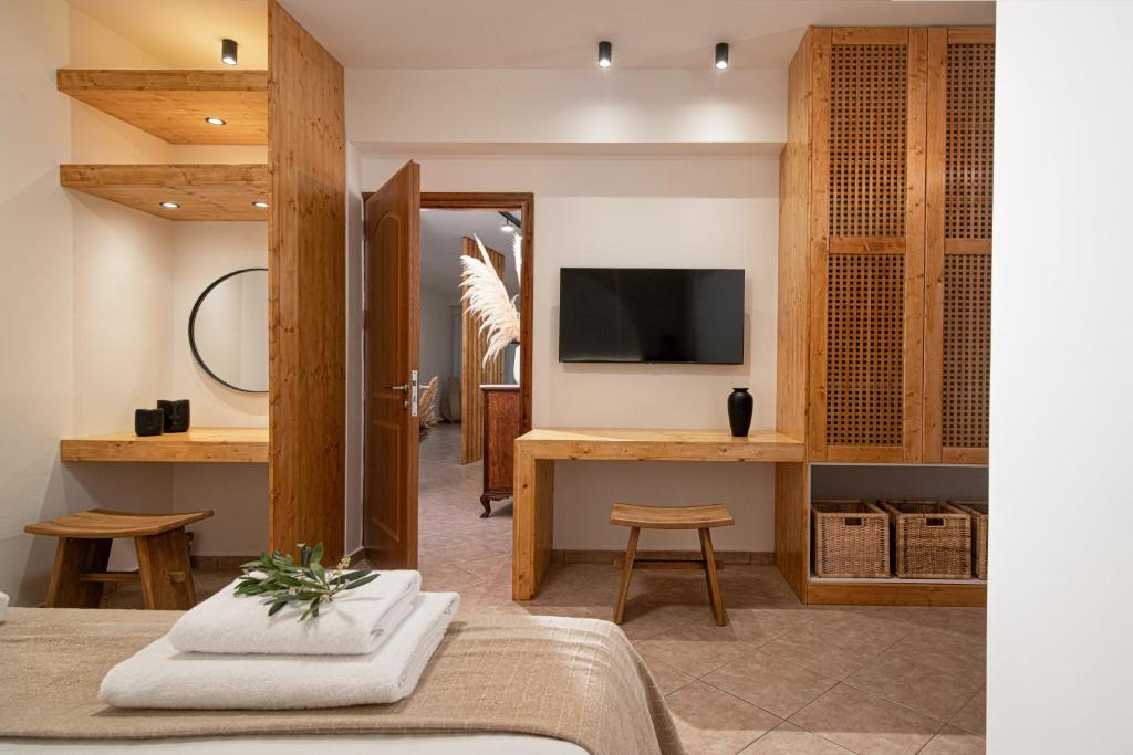 Televízia a/alebo spoločenská miestnosť v ubytovaní Elèa Concept Hotel & Suites