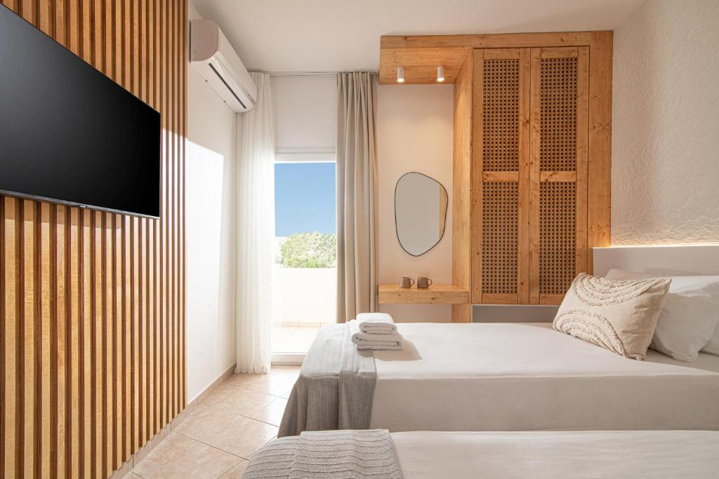 Posteľ alebo postele v izbe v ubytovaní Elèa Concept Hotel & Suites