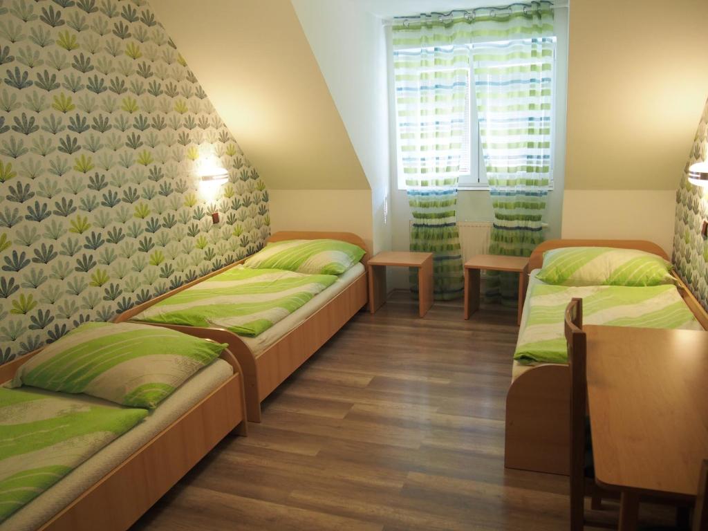 Postel nebo postele na pokoji v ubytování Hotel Olga