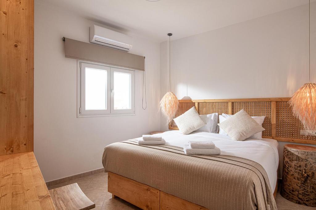 Posteľ alebo postele v izbe v ubytovaní Elèa Concept Hotel & Suites