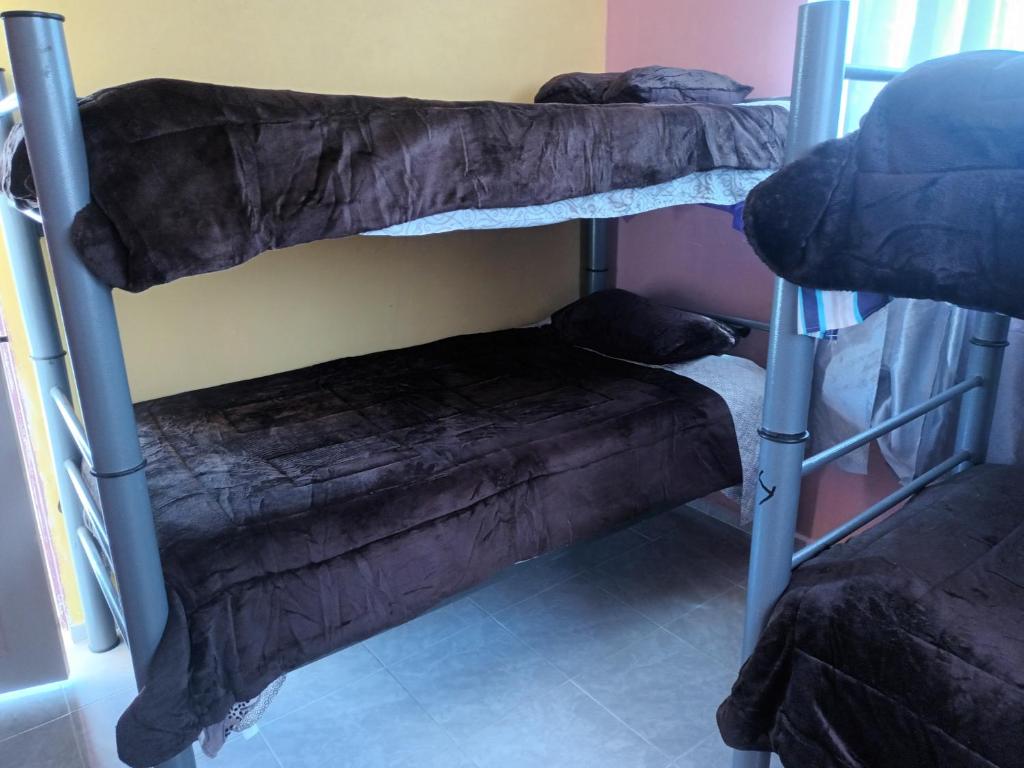 Palanda nebo palandy na pokoji v ubytování Hospedaje Barato Mi Casita de Colores
