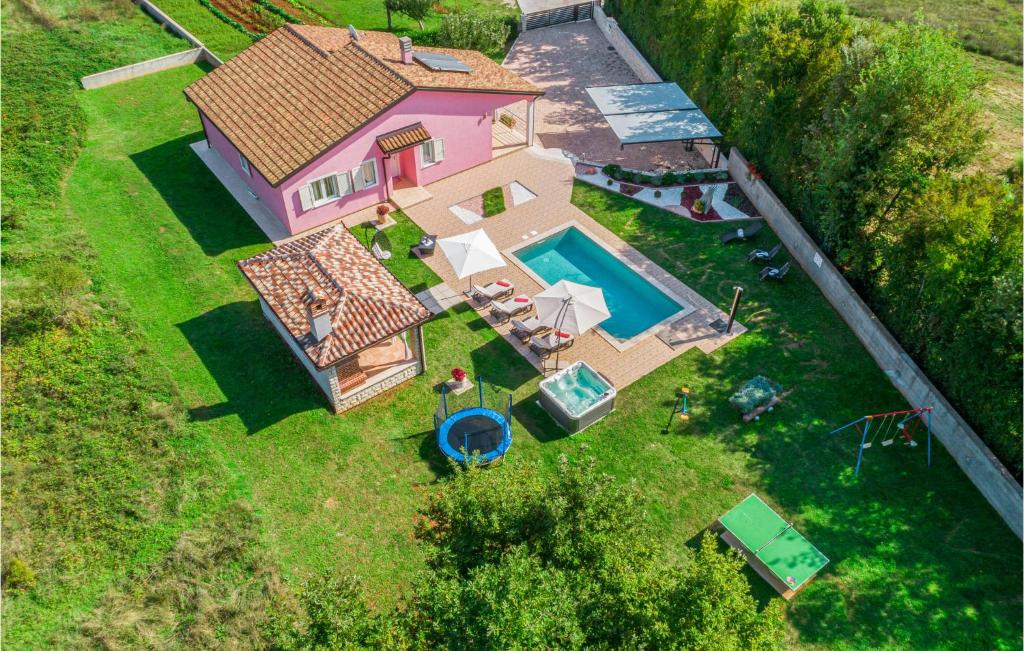 an overhead view of a house with a swimming pool at 3 Bedroom Gorgeous Home In Labin in Labin