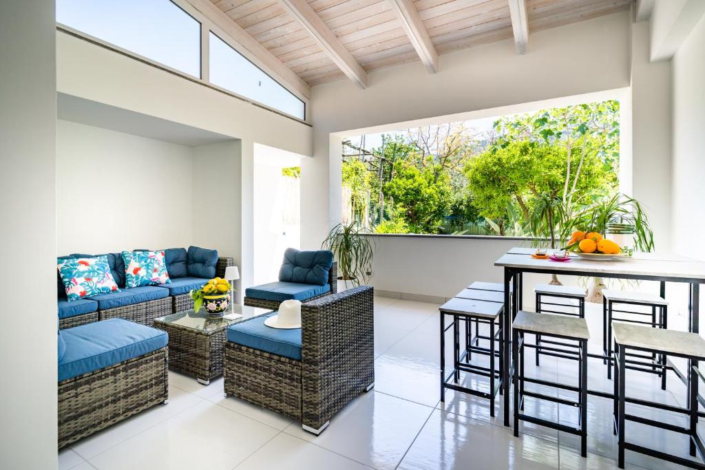 a living room with a couch and a table at Villa Talia in Sorrento