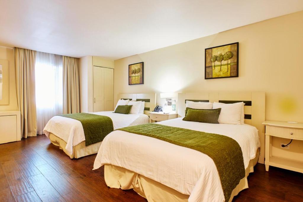 Postel nebo postele na pokoji v ubytování Isabella Boutique Hotel