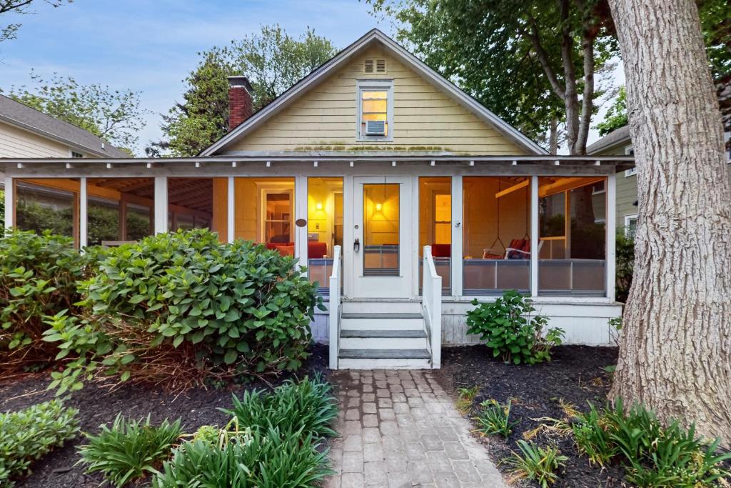 a house with a porch with glass doors at Town of Rehoboth Beach --- 206 Norfolk St in Rehoboth Beach