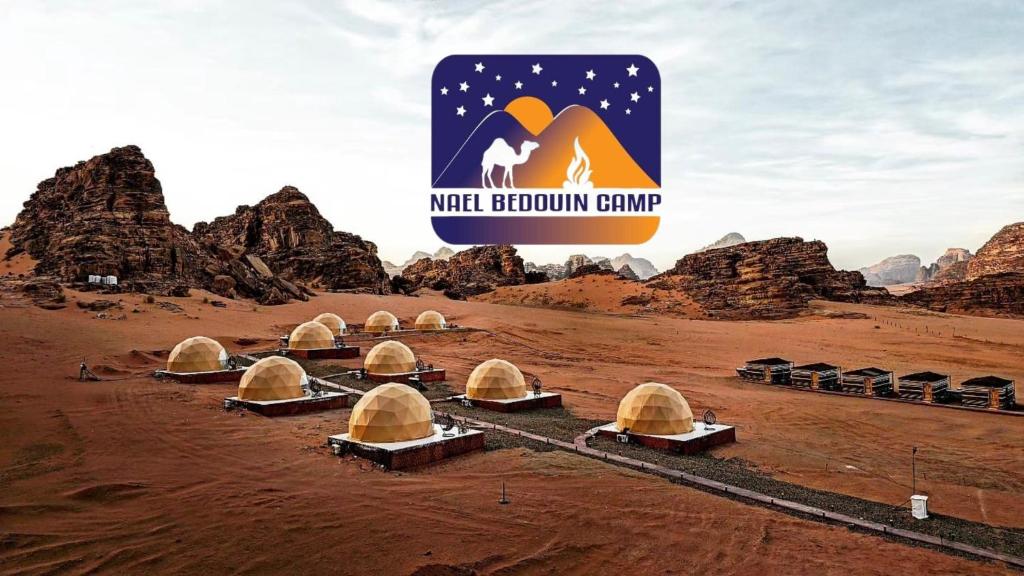 a group of domes in the desert with the wichita mountain camp at Nael Bedouin camp in Wadi Rum