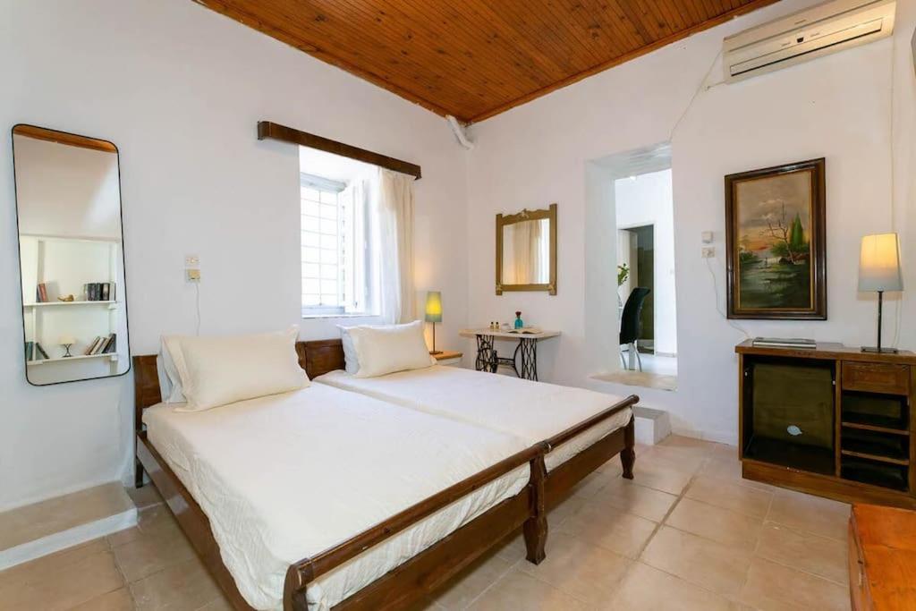 Postel nebo postele na pokoji v ubytování Chrysa s house
