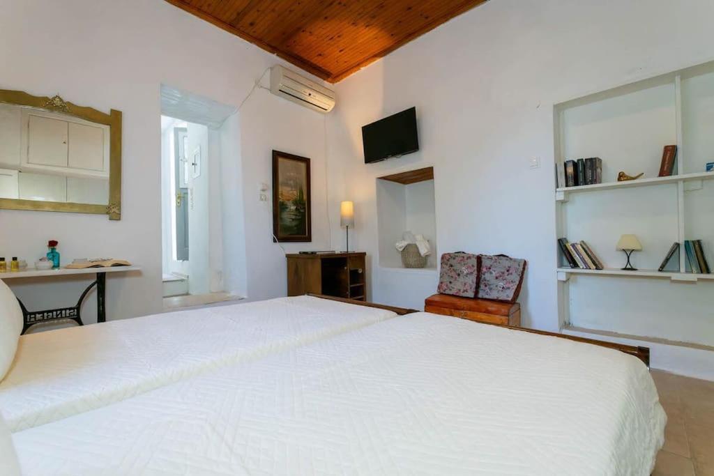Postel nebo postele na pokoji v ubytování Chrysa s house
