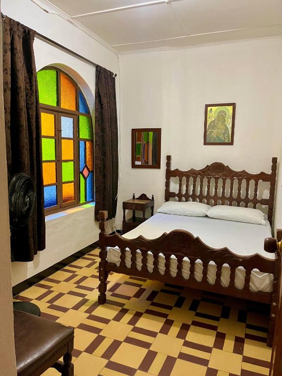Postel nebo postele na pokoji v ubytování Casa Grande Hostal