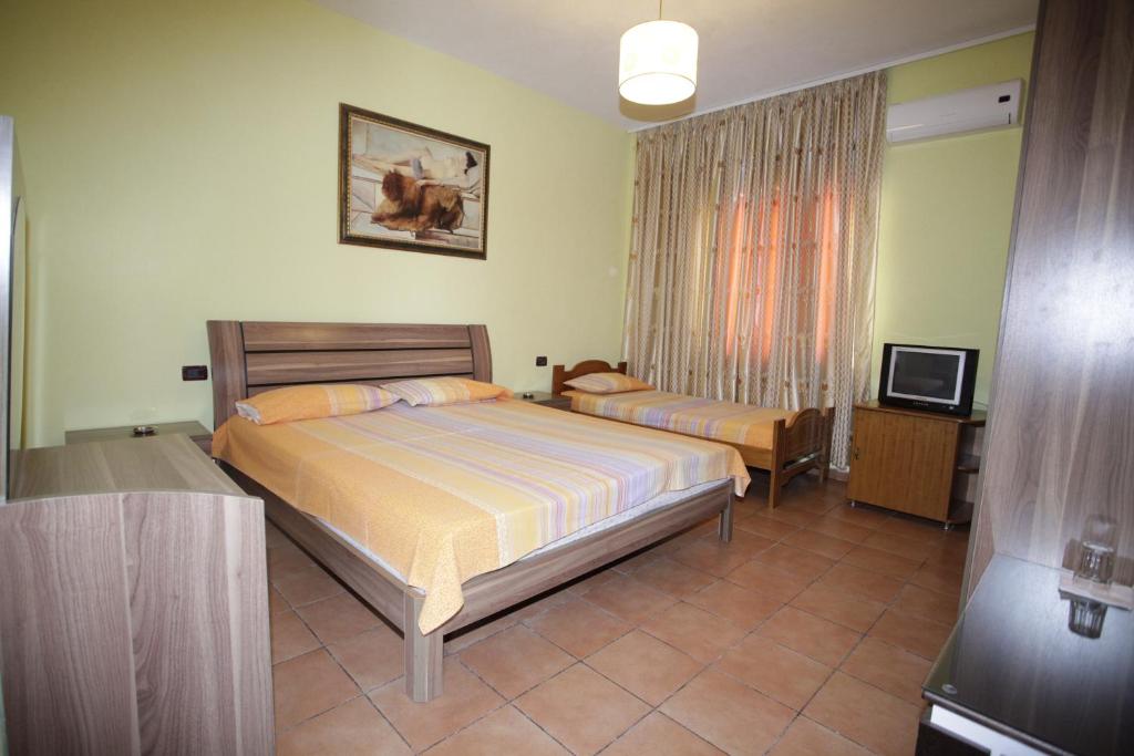 Postel nebo postele na pokoji v ubytování Alen Bar Hotel