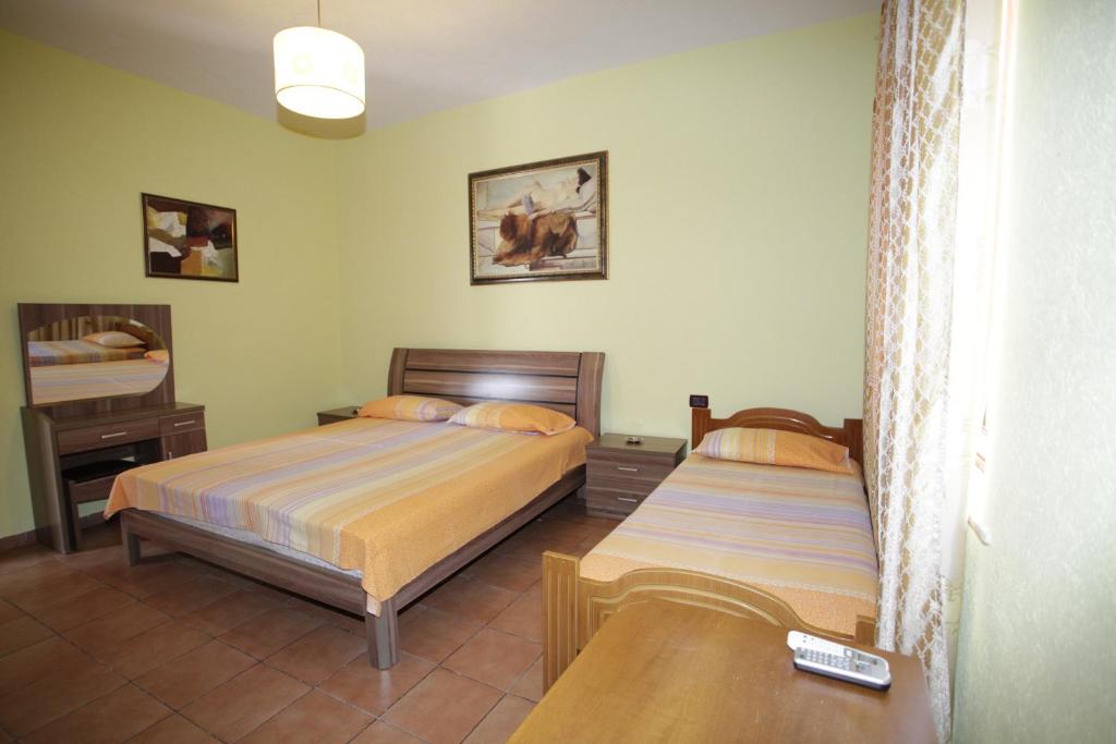 Postel nebo postele na pokoji v ubytování Alen Bar Hotel