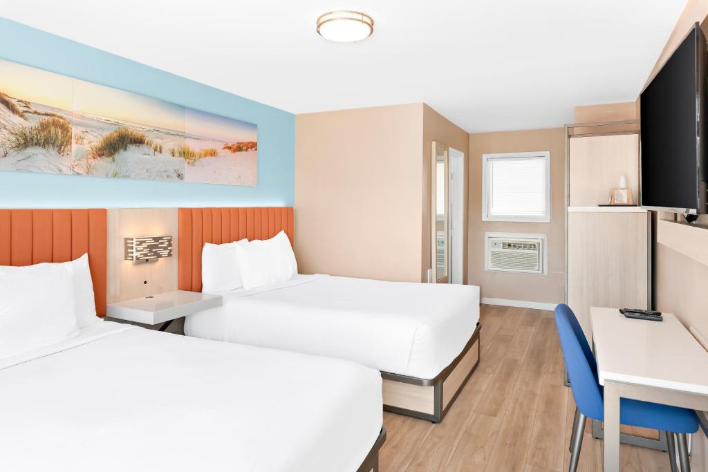 Postel nebo postele na pokoji v ubytování Mango Motel Wildwood Beach & Boardwalk