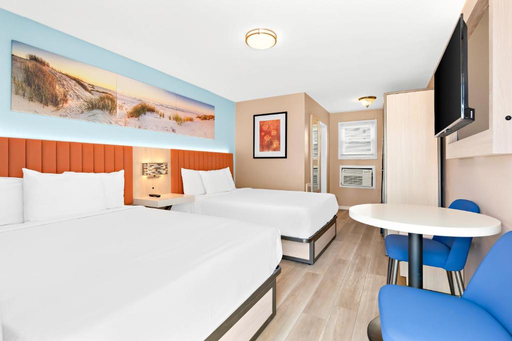 Postel nebo postele na pokoji v ubytování Mango Motel Wildwood Beach & Boardwalk