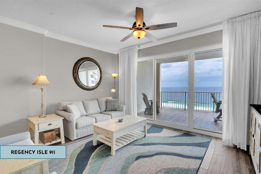 a living room with a couch and a ceiling fan at Regency Isle 911 in Orange Beach