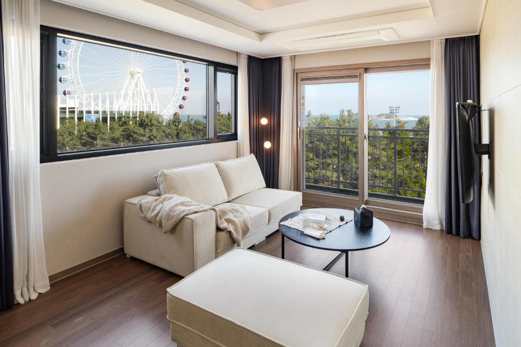 a living room with a couch and a table at Urbanstay Sokcho Beach AB in Sokcho