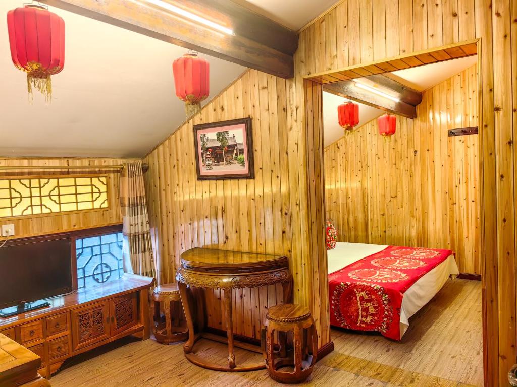 Postel nebo postele na pokoji v ubytování Pingyao Harmony Hotel