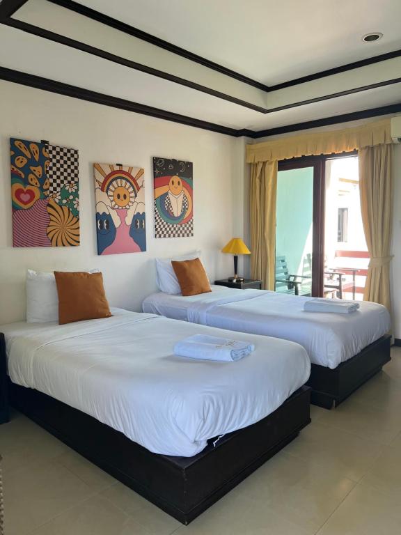 Postel nebo postele na pokoji v ubytování Samui Seabreeze Place