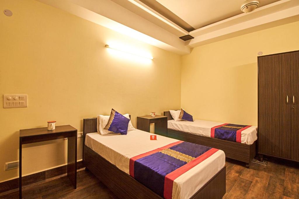 Een bed of bedden in een kamer bij OYO 3594 Kamla Nagar