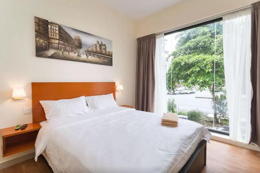 Postel nebo postele na pokoji v ubytování Penang Hill Lodge