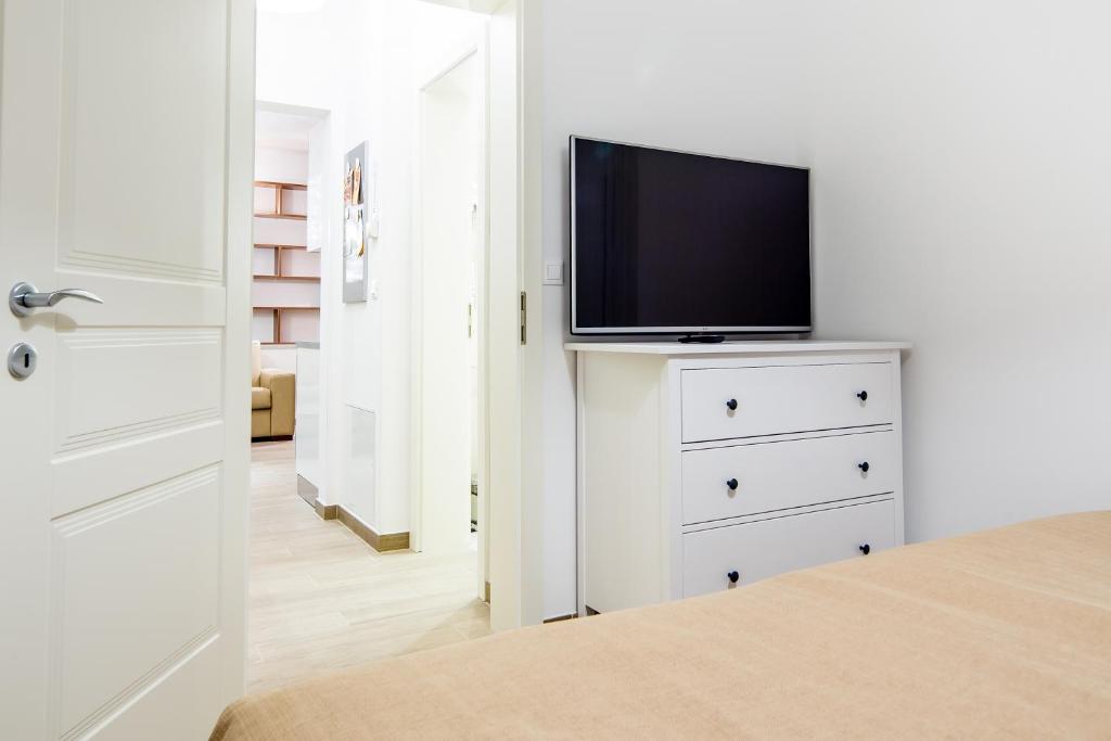 TV a/nebo společenská místnost v ubytování WH Apartments