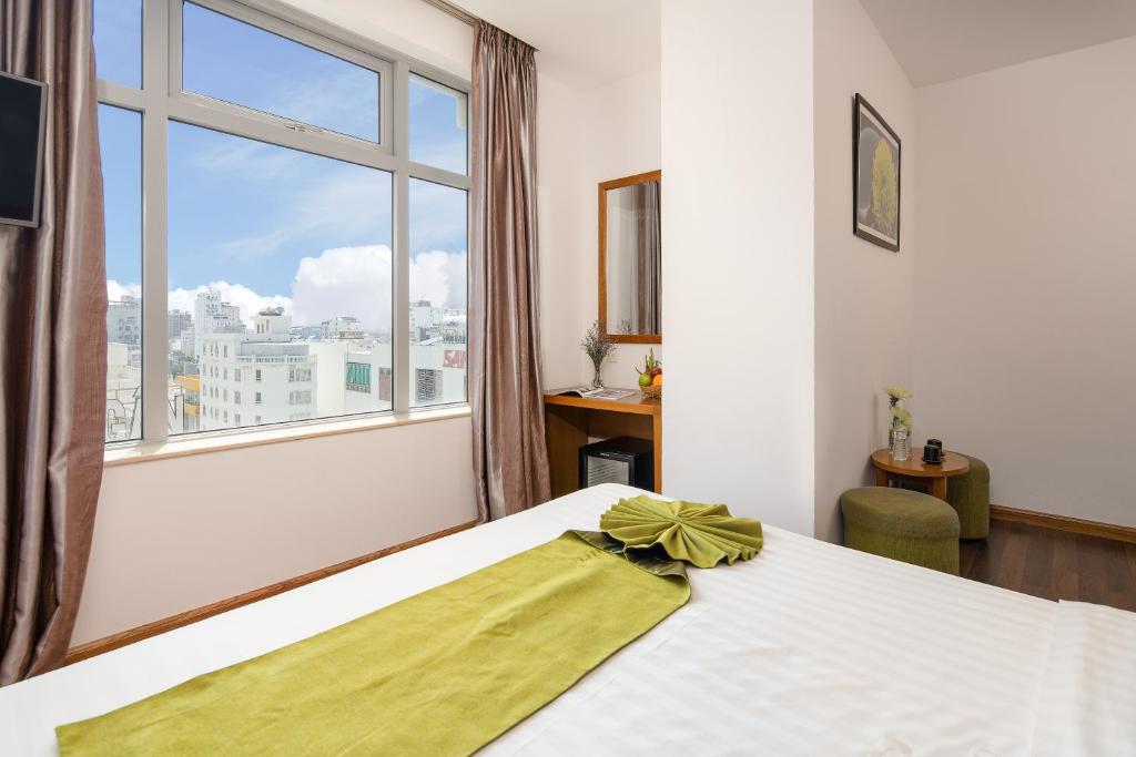 Postel nebo postele na pokoji v ubytování Richico Apartments And Hotel
