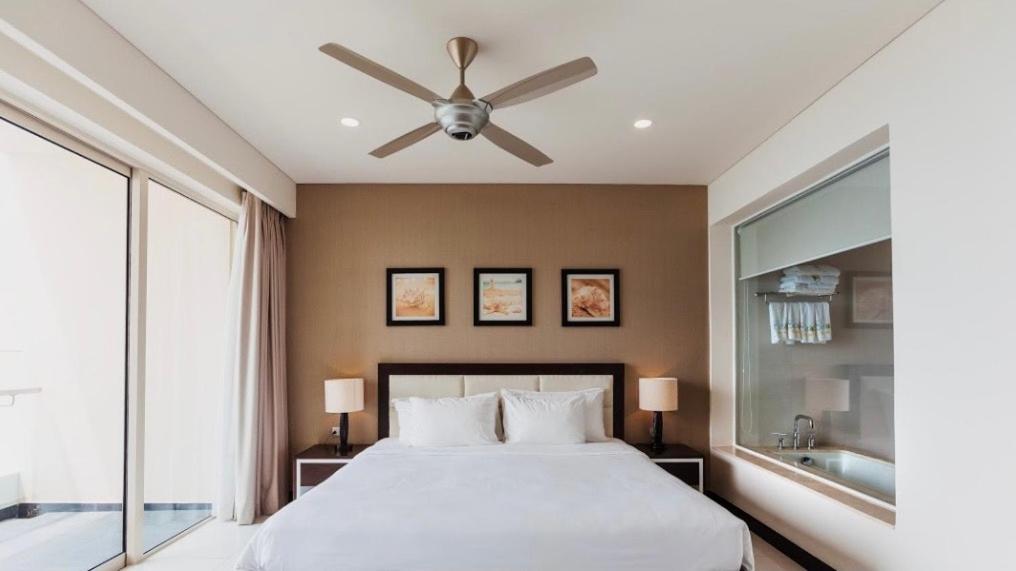 Кровать или кровати в номере Central Nha Trang Apartment