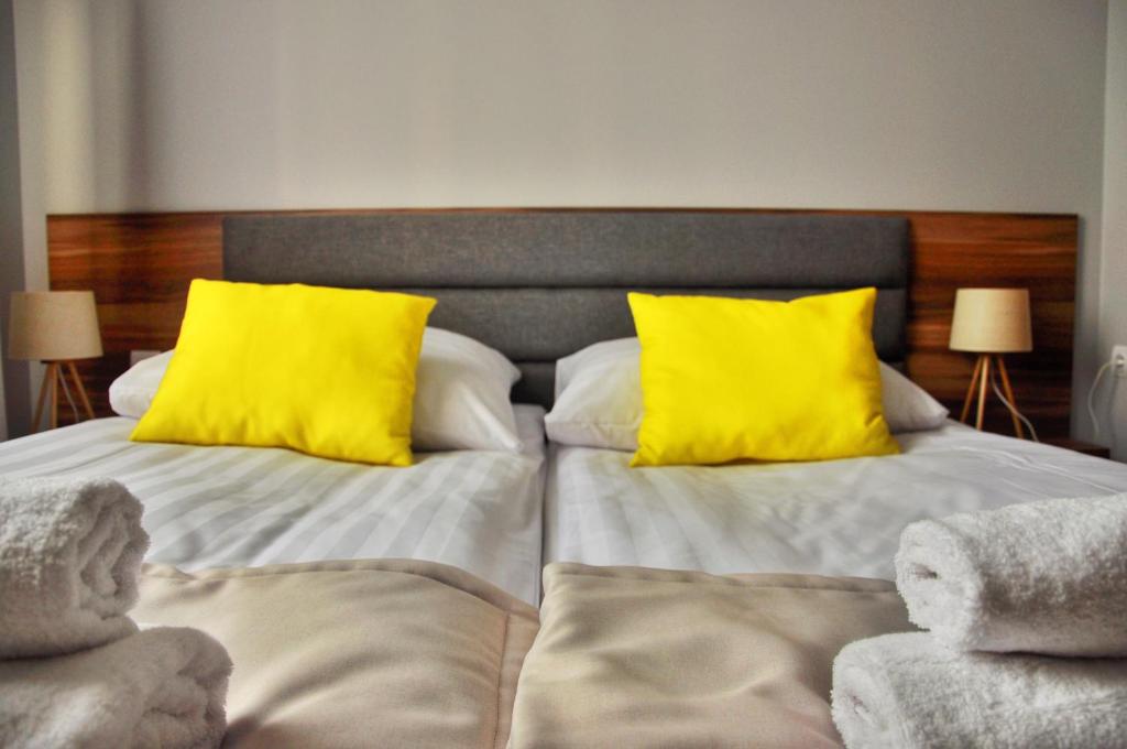 Postel nebo postele na pokoji v ubytování Hotel Klondaik Corner